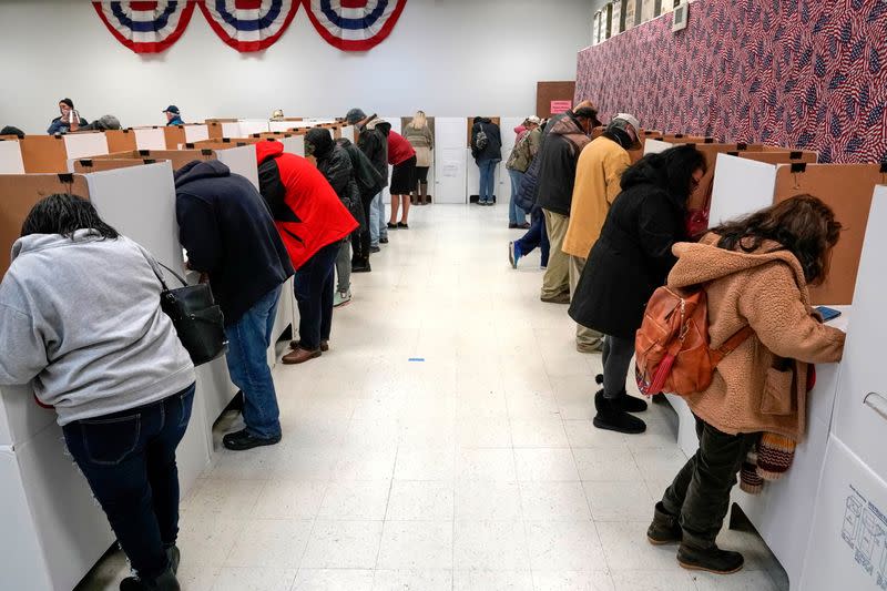 Voters stand at voting booths during early voting at the Oklahoma Election Board in Oklahoma City