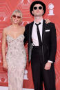 <p>Sienna Miller smiles big on the red carpet with Tom Sturridge. </p>