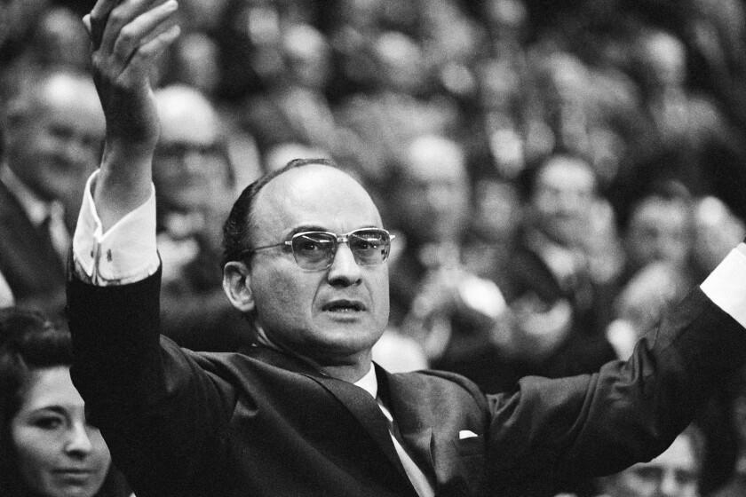 FILE - Luis Echeverria Alvarez speaks to party members after becoming the official nominee for the 1970-76 presidential race, during the closing session of the ruling Institutional Revolutionary Party's conventional at the Olympic Sports Palace in Mexico City, Nov. 16, 1969. Current President Andres Manuel Lopez Obrador confirmed the death of Echeverria on Saturday, July 9, 2022. Echeverria, who governed from 1970 to 1976, was 100. (AP Photo)