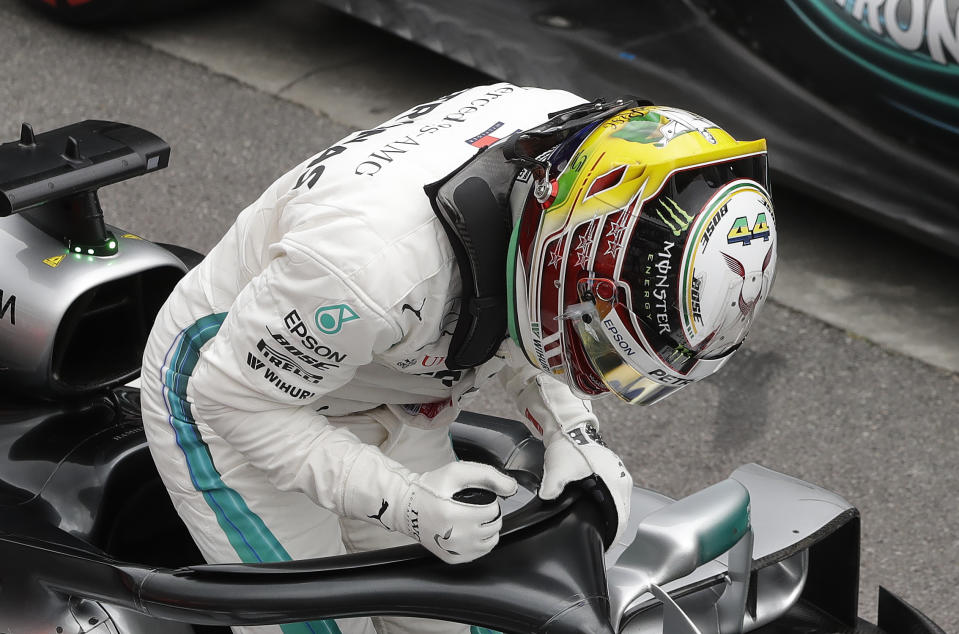 Mercedes driver Lewis Hamilton, of Britain, celebrates after he clocked the fastest time during the qualifying session for the Brazilian Formula One Grand Prix at the Interlagos race track in Sao Paulo, Brazil, Saturday, Nov. 10, 2018. (AP Photo/Andre Penner)