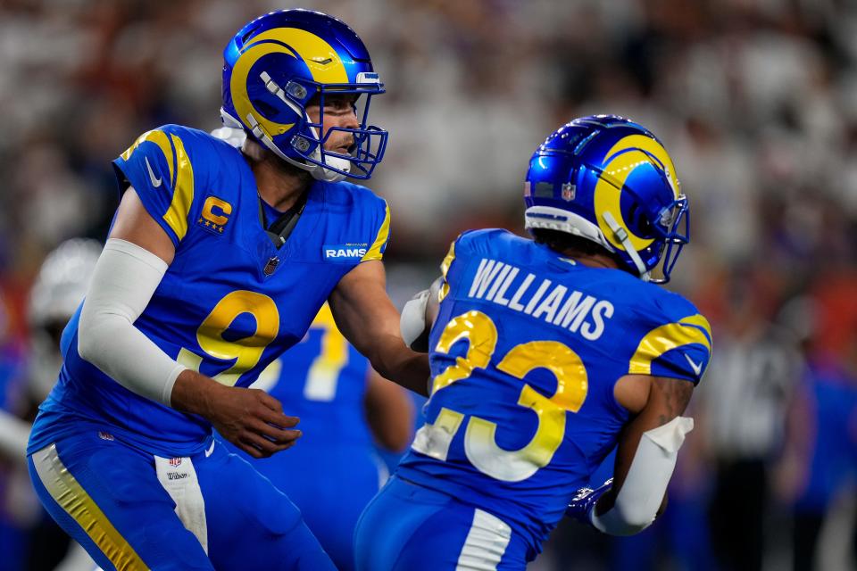 Los Angeles Rams quarterback Matthew Stafford (9) hands off to running back Kyren Williams (23) in the second quarter of the NFL Week 3 game between the Cincinnati Bengals and the Los Angeles Rams at Paycor Stadium in downtown Cincinnati on Monday, Sept. 25, 2023. The game was tied 6-6 at halftime.