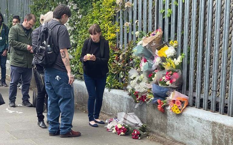 A vigil close to the scene in Ealing where Anna Jedrkowiak, known as Ania, was murdered by Dennis Akpomedaye - Metropolitan Police/PA