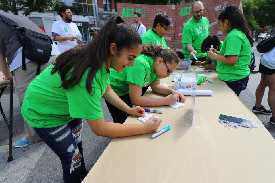 <p>Students create art for the LEAP Public Art Program’s citywide exhibition in Union Square Park in New York City on June 5, 2018. (Photo: Gordon Donovan/Yahoo News) </p>