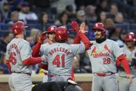 St. Louis Cardinals' Alec Burleson (41) celebrates with Paul Goldschmidt (46) and Nolan Arenado (28) after hitting a three-run home run against the New York Mets during the second inning of a baseball game Friday, April 26, 2024, in New York. (AP Photo/Frank Franklin II)