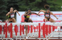 Heptathlete Jessica Zelinka, left, makes her way to a win in the women's 100-metre hurdles championship as she races against Perdita Felicien, middle, and Priscilla Lopes-Schliep at the Canadian Track and Field Championships in Calgary, Alta., Saturday, June 30, 2012.THE CANADIAN PRESS/Sean Kilpatrick