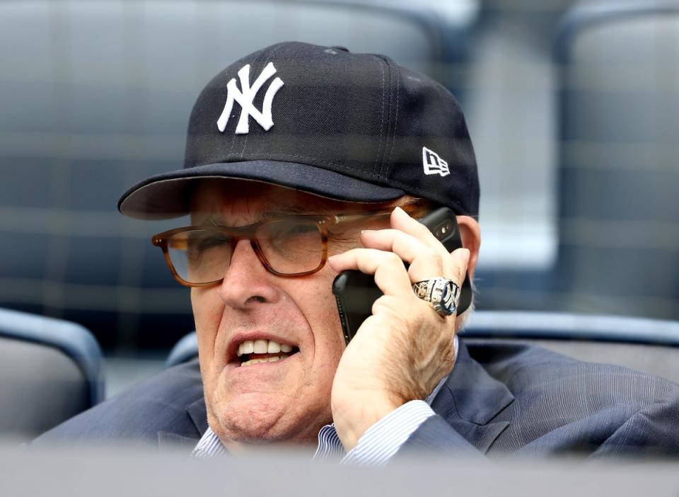 Former mayor Rudy Giuliani boasting Yankees gear at a baseball game in May 2018  (Getty Images)