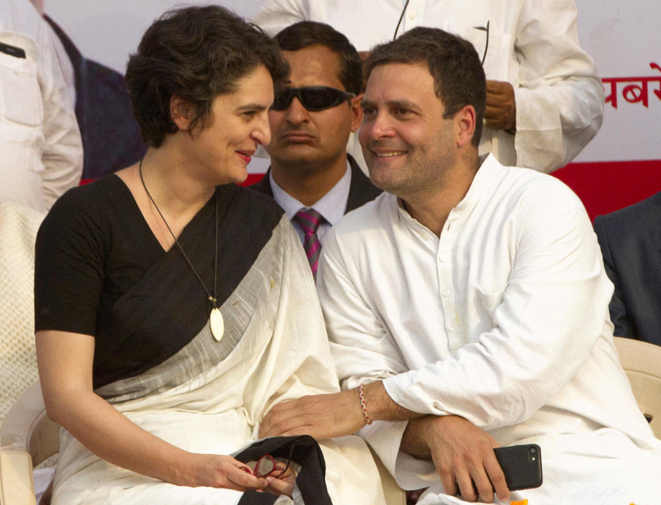 FILE- In this Thursday, Feb. 16, 2017, file photo, Congress party President Rahul Gandhi, right, speaks with his sister Priyanka Gandhi Vadra during an election campaign rally in Rae Barelli in the northern Indian state of Uttar Pradesh, India. Priyanka Gandhi Vadra, the scion of India's most famous political dynasty, has formally entered party politics with opposition Congress party assigning her a position as it prepares for the national elections due before May. (AP Photo/Rajesh Kumar Singh, file)