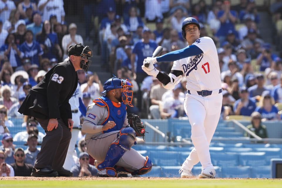 Los Angeles Dodgers designated hitter Shohei Ohtani (17) swings a strike during the sixth inning of a baseball game against the New York Mets in Los Angeles, Saturday, April 20, 2024. (AP Photo/Ashley Landis)
