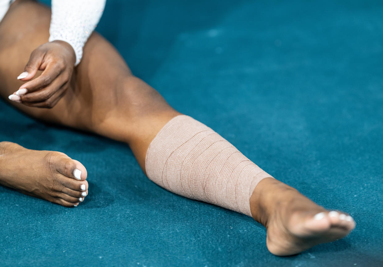 Simone Biles with her leg wrapped at the women's team final on July 30.