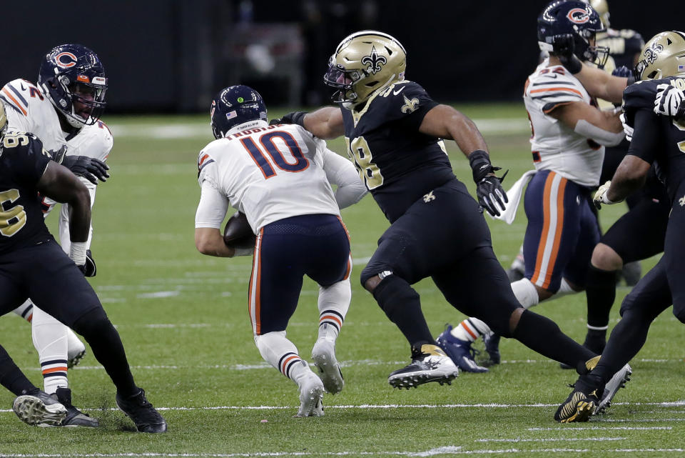 Chicago Bears quarterback Mitchell Trubisky (10) is sacked by New Orleans Saints defensive tackle Sheldon Rankins (98) in the second half of an NFL wild-card playoff football game in New Orleans, Sunday, Jan. 10, 2021. (AP Photo/Brett Duke)
