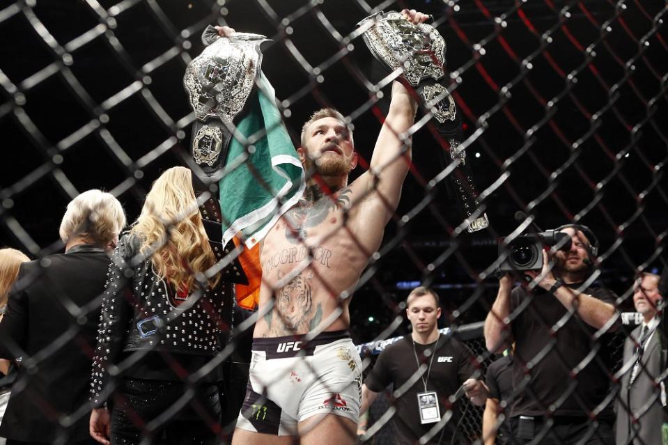 Conor McGregor became the first UFC fighter to win titles in two divisions at UFC 205. (USA TODAY Sports)