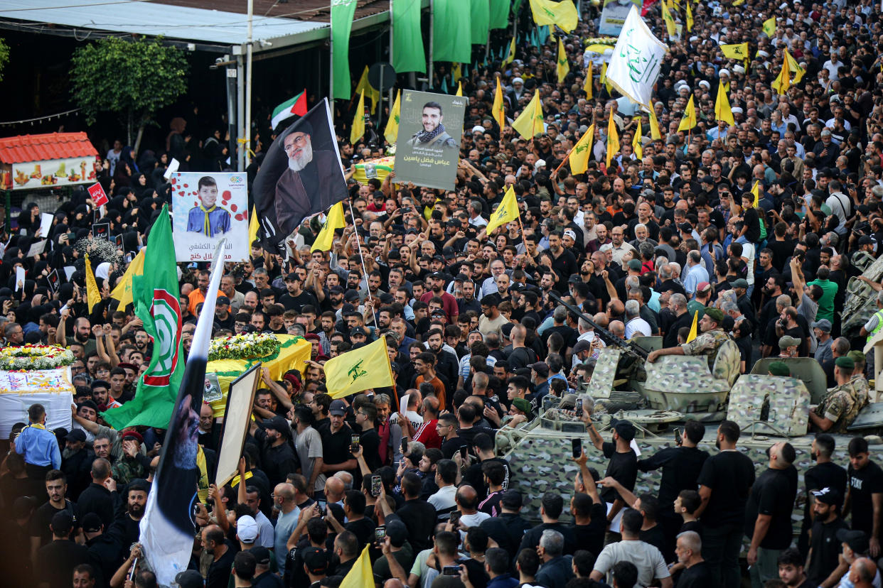 18 September 2024, Lebanon, Beirut: Hezbollah supporters carry the coffin of a victim who was killed in electronic pagers explosion, during a funeral procession in Beirut southern suburb. Thousands people were wounded in the cyberattack and 12 were killed so far in the latest toll announced by the ministry of health. Hezbollah has blamed Israel for the detonations on 17 September and promised retaliation. Several of its fighters, as well as high-ranking representatives and members of the Radwan Force, an elite unit within the group, are said to be among the victims. Photo: Marwan Naamani/dpa (Photo by Marwan Naamani/picture alliance via Getty Images)