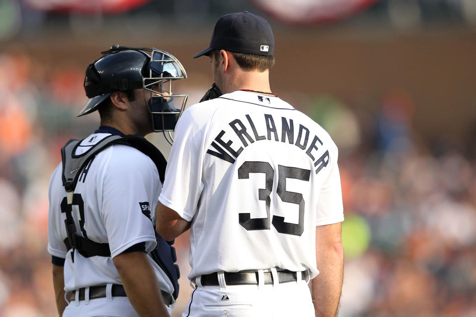 DETROIT, MI - OCTOBER 13: Justin Verlander #35 speaks with Alex Avila #13 of the Detroit Tigers during Game Five of the American League Championship Series against the Texas Rangers at Comerica Park on October 13, 2011 in Detroit, Michigan. (Photo by Leon Halip/Getty Images)