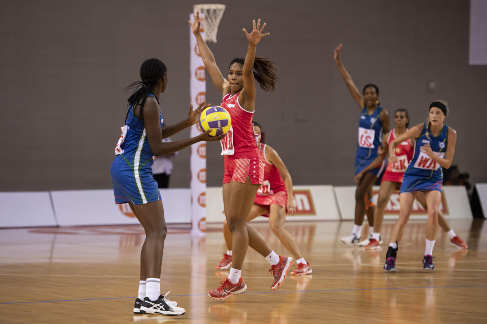 Singapore's wing defence Aqilah Andin blocks the passing lane of the Namibia players during the Netball Nations Cup final at the OCBC Arena. (PHOTO: Netball Singapore)