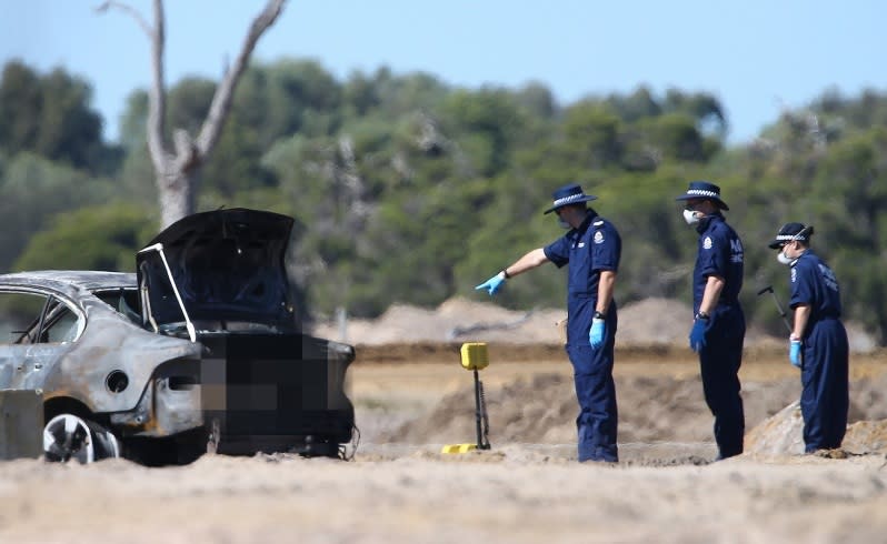 Police and forensic officers at The Avenue estate on Rowley Road in Hilbert where the body of Travis Mills was found in a burnt out vehicle. Picture : Lincoln Baker/The West Australian.