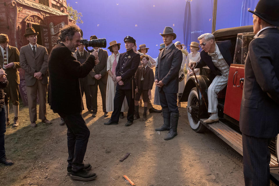 Joseph Gatt’s behatted Skellig guards Vandemere’s car as Michael Keaton exits. (Disney)