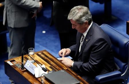 Senator Fernando Collor de Mello votes to impeach President Dilma Rousseff for breaking budget laws in Brasilia, Brazil, May 12, 2016.REUTERS/Ueslei Marcelino