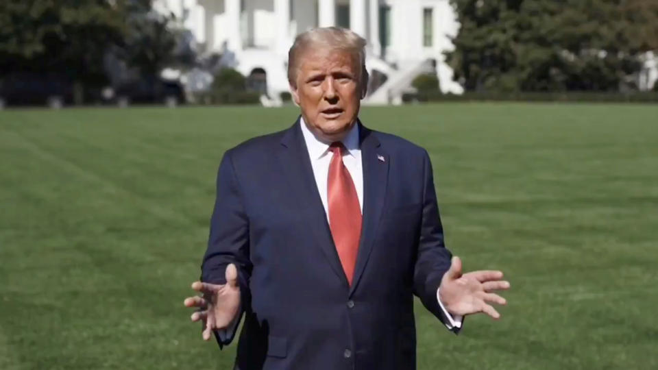 President Donald Trump speaks outside the White House, where he is being treated for the coronavirus disease (COVID-19), in Washington, U.S. in this still image taken from social media video released on October 8, 2020. (@realDonaldTrump/via Reuters)