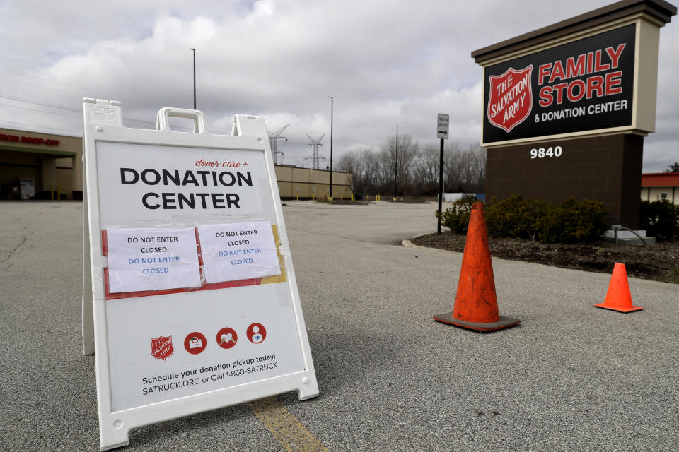 FILE - In this April 1, 2020 file photo, a closed sign is displayed outside a Salvation Army store and donation center in Glenview, Ill. Across the country, drug and alcohol recovery programs claiming to help the poor and the desperate are instead conscripting them into forms of indentured servitude, requiring them to work without pay or for pennies on the dollar, in exchange for their stay. For the first time, Reveal from The Center for Investigative Reporting has determined how widespread these programs have become. In 1990, in response to a complaint from a former participant, the Labor Department launched an investigation into the nation's largest chain of work-based rehabs, The Salvation Army, which operates about 100 programs across the country. At The Salvation Army's rehabs, participants were required to work full time processing donations for the organization's thrift stores, receiving a stipend of only $5 to $20 a week. The department found The Salvation Army had violated labor laws and ordered the nonprofit to pay its participants minimum wage. The Salvation Army refused to comply. It sued, then enlisted members of Congress to defend the venerable charity. Within a month, the department backed off.(AP Photo/Nam Y. Huh, File)