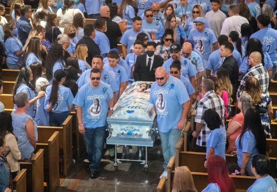 The casket of 15-year-old Alycia "Lala" Reynaga is escorted out of the Cathedral of the Annunciation after funeral services in Stockton on May 4, 2022. Reynaga, a Stagg High School student, was stabbed and killed by a school intruder on April 18, 2022.