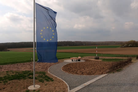 A European flag flutters near a red-white pole, marking the new geographical centre of the European Union in case of Brexit in Gadheim, Germany, April 8, 2019. The town of less than 100 residents prepares to become the geographical centre of the European Union after Brexit. Meanwhile, the EU's current geoegraphical centre, Westerngrund, just 60 kilometres away, will lose its title. REUTERS/Tilman Blasshofer