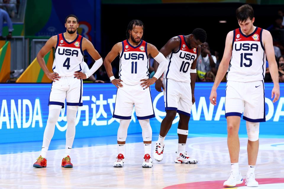 Tyrese Haliburton (4), Jalen Brunson (11), Anthony Edwards (10) and Austin Reaves (15) of the United States react in overtime during the FIBA World Cup game against Canada.