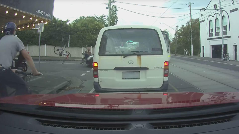 The cyclist is seen hitting the car's bonnet and the bike flies through the air. Source: Facebook/Dash Cam Owners Australia