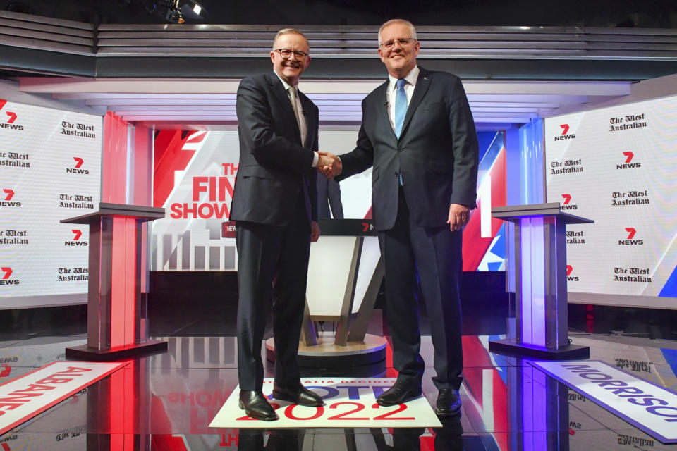 FILE - Australian Prime Minister Scott Morrison, right, and Australian opposition leader Anthony Albanese shake hands ahead of the leaders' debate in Sydney, Australia, on May 11, 2022. Australians go to the polls on Saturday, May 21, following a six-week election campaign that has focused on pandemic-fueled inflation, climate change and fears of a Chinese military outpost being established less than 2,000 kilometers (1,200 miles) off Australia’s shore.(Mick Tsikas/Pool Photo via AP, File)