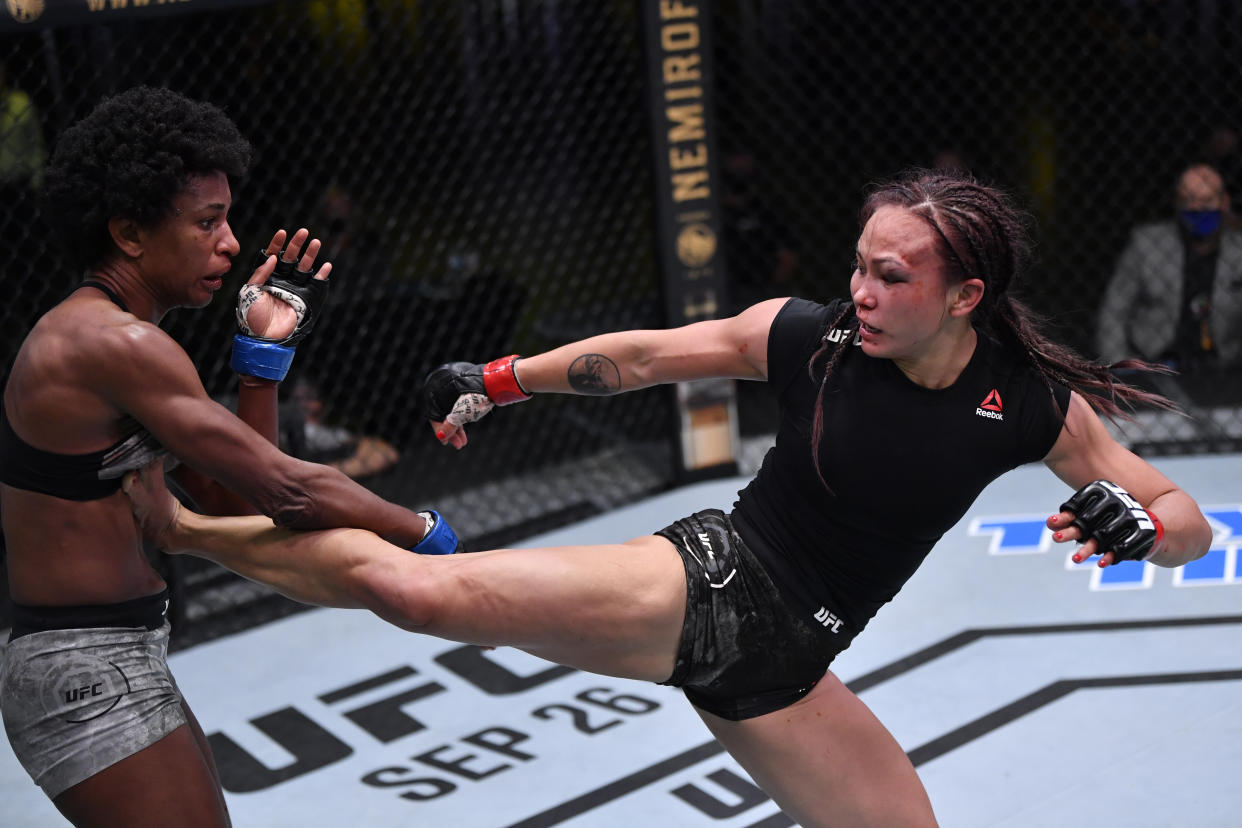 LAS VEGAS, NEVADA - SEPTEMBER 12: (R-L) Michelle Waterson kicks Angela Hill in a strawweight fight during the UFC Fight Night event at UFC APEX on September 12, 2020 in Las Vegas, Nevada. (Photo by Jeff Bottari/Zuffa LLC)