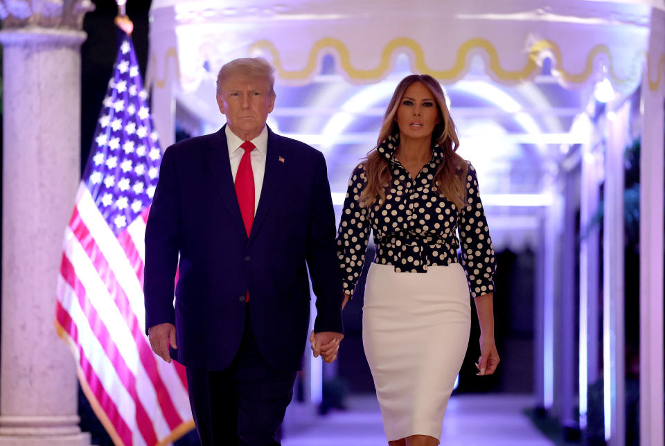 PALM BEACH, FLORIDA - NOVEMBER 15: Former U.S. President Donald Trump and former first lady Melania Trump arrive for an event at his Mar-a-Lago home on November 15, 2022 in Palm Beach, Florida. Trump announced that he was seeking another term in office and officially launched his 2024 presidential campaign.  (Photo by Joe Raedle/Getty Images)