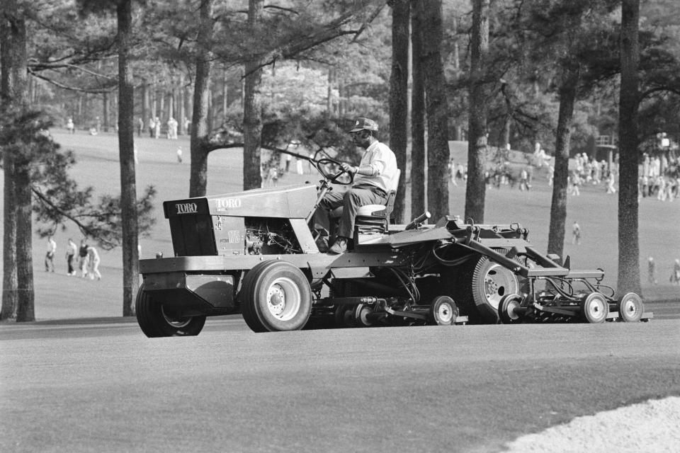 Mowers and grounds crew work ahead of the 1981 Masters.