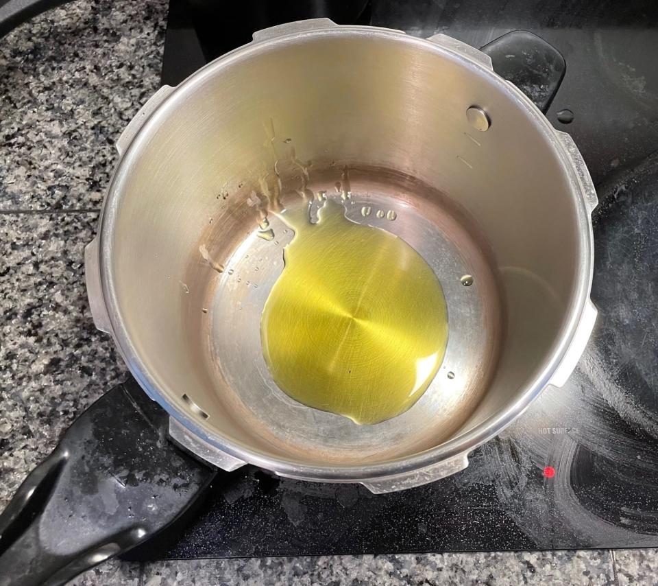Olive oil in pot for Greek dad's kritharaki
