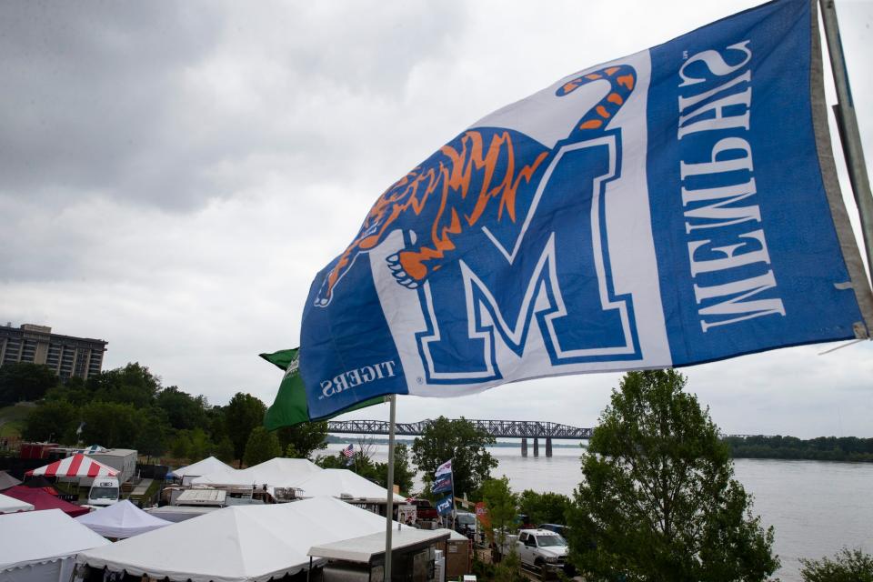 Booths in the Whole Hog section of the park are seen as a University of Memphis flag flies from the top floor of the Barbeque Republic booth before the start of the Memphis in May World Championship Barbecue Cooking Contest at Tom Lee Park in Downtown Memphis on Wednesday, May 17, 2023.