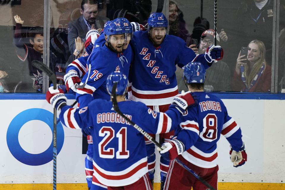 The New York Rangers celebrate after a goal by Will Cuylle (50) during the third period of an NHL hockey game against the Carolina Hurricanes, Thursday, Nov. 2, 2023, in New York. (AP Photo/Frank Franklin II)