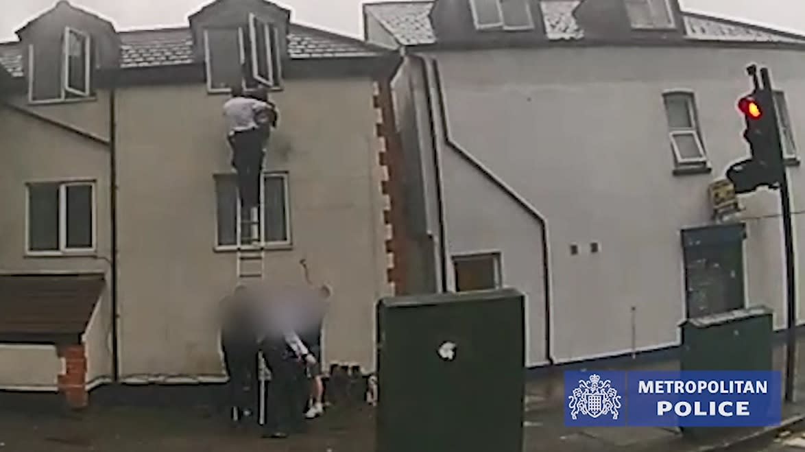 Acting Sergeant Tony Ruth used a ladder to rescue the children from the fire. (Met Police)