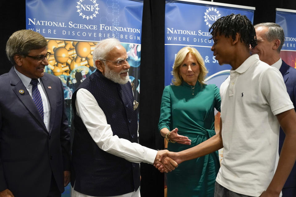 First lady Jill Biden and India's Prime Minister Narendra Modi greet Noah Isirimah as they visit the National Science Foundation in Alexandria, Va., Wednesday June, 21, 2023. Watching are Sethuraman Panchanathan, director of the National Science Foundation, left, and U.S. Ambassador to India Eric Garcetti. (AP Photo/Jacquelyn Martin)