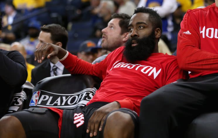 James Harden waits out the final Rockets game of last season. (Ezra Shaw/Getty Images)