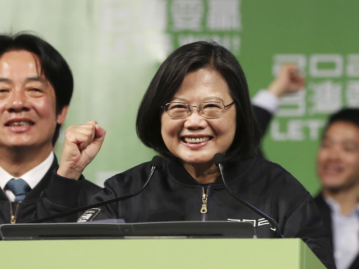 Tsai Ing-wen celebrates her re-election with supporters at a rally: AP