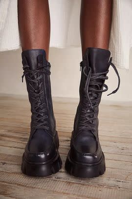 A pair of lug-sole lace-up boots