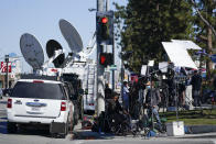 Members of the media stand outside Harbor-UCLA Medical Center Wednesday, Feb. 24, 2021, in Torrance, Calif. Golfer Tiger Woods was hospitalized and underwent surgery at the hospital following a car accident on Tuesday. (AP Photo/Ashley Landis)