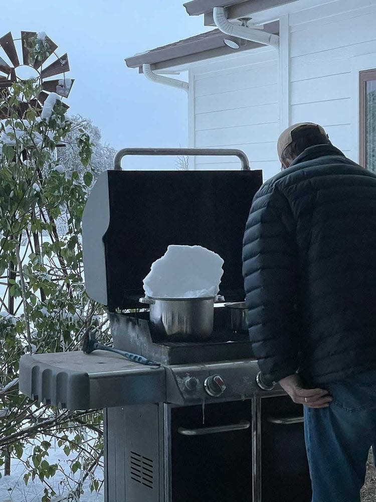 Crawford's family using their grill to melt ice