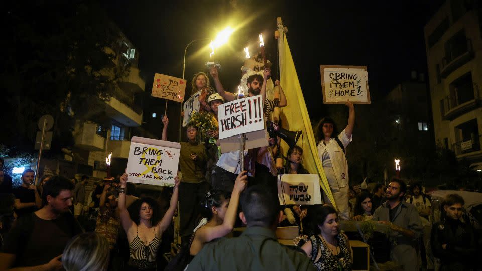 Protesters hold signs in support of Gaza hostages near Prime Minister Benjamin Netanyahu's residence, during a demonstration calling for his ouster. - Ronen Zvulun/Reuters