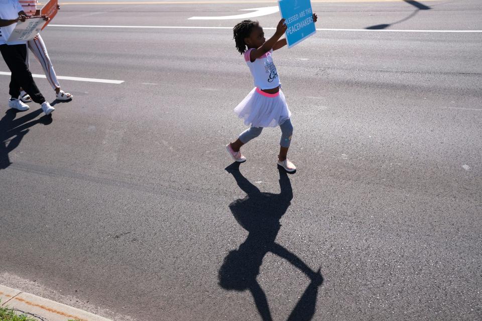 People march north on Martin Luther King Jr Blvd. at the Dream Peace Walk in Oklahoma City from Douglass High School to the Bridge Impact Youth Center, to celebrate the anniversary of Dr. Rev. Martin Luther King, Jr's Letters from Birmingham,  Sunday, April 16, 2023.