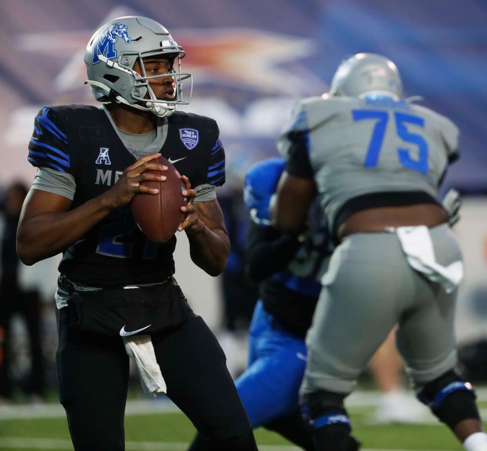 During Memphis Football’s "Friday Night Stripes” game team gray Tevin Carter (21) looks to make a pass against team blue at the Simmons Bank Liberty Stadium on April 21, 2023.