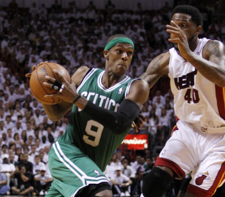 FILE - In thbis June 9, 2012 file photo, Boston Celtics' Rajon Rondo (9) drives to the basket as Miami Heat's Udonis Haslem (40) defends during the second half of Game 7 of the NBA basketball playoffs Eastern Conference finals, in Miami. President Barack Obama is joining with NBA legend Michael Jordan and an array of basketball stars to raise money for his re-election campaign later this month. The Obama campaign is planning a fundraising "shoot-around" and dinner in New York on Aug. 22 featuring several NBA stars. (AP Photo/Lynne Sladky, File)