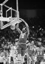 FILE - Philadelphia 76ers' Moses Malone slams home two of his 24 points in a playoff game against the Lakers, in Los Angeles, Calif., on May 31, 1983. The Sixers went on to sweep the Lakers four games straight to win the NBA championship. (AP Photo, File)