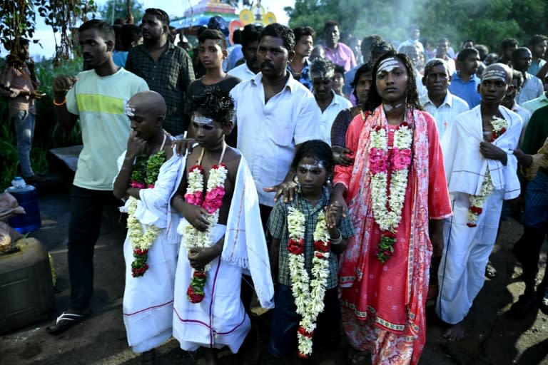 Children of victims who died after consuming toxic alcohol, arrive for a mass cremation in Kallakurichi district (R.Satish BABU)