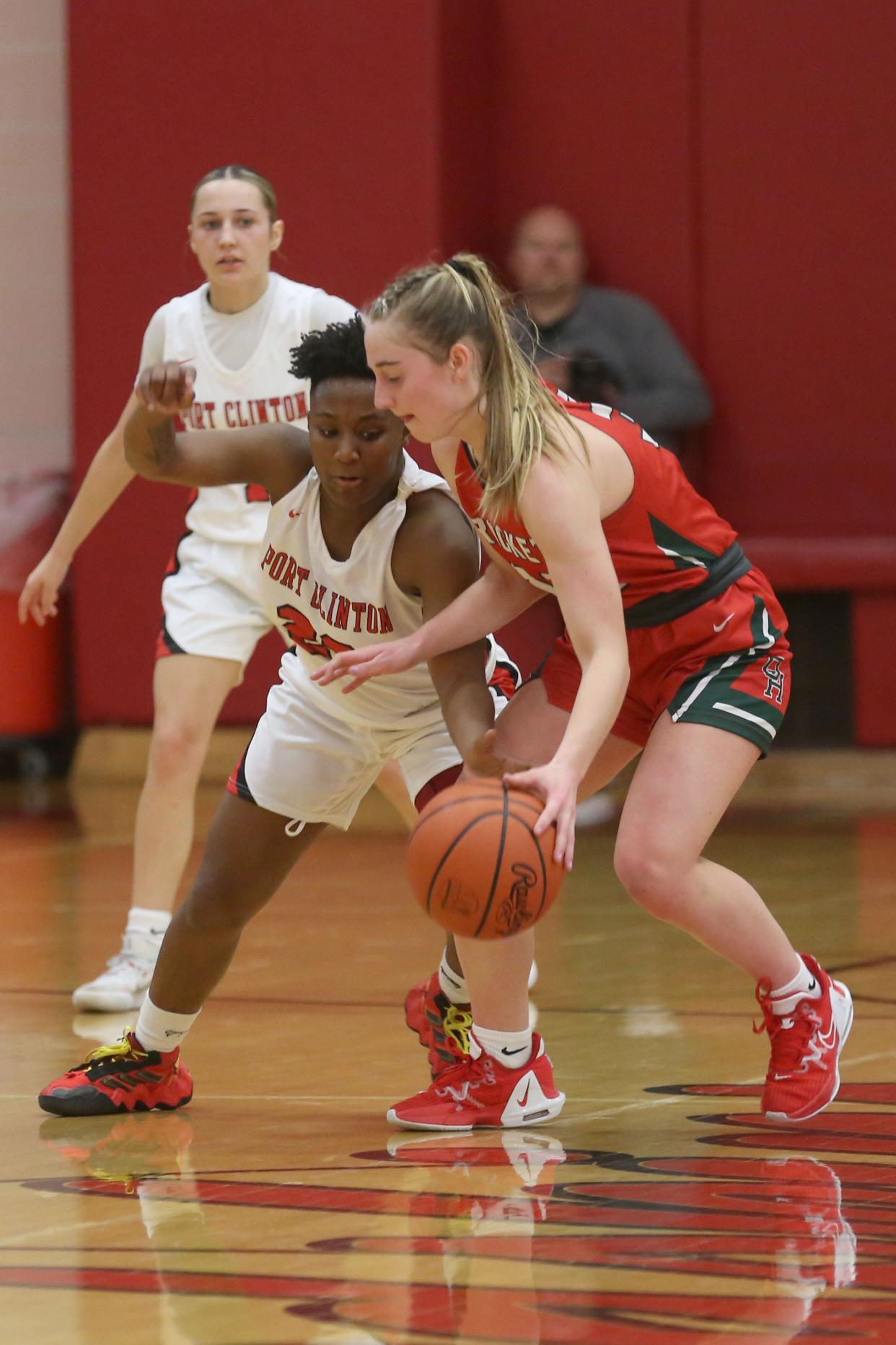 Oak Harbor's Camdyn Fauver handles the ball as Port Clinton's DC Lanier goes for a steal.