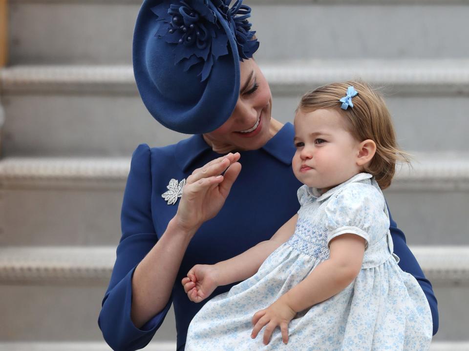 Kate Middleton demonstrating how to wave for Princess Charlotte