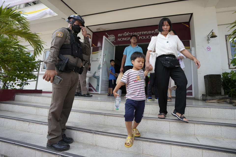 Members of the Shenzhen Holy Reformed Church, also known as the Mayflower Church, leave from the Nongprue police station on their way to Pattaya Provincial Court in Pattaya, Thailand, Friday, March 31, 2023. More than 60 members of a Chinese Christian church have been detained in Thailand, supporters said Friday, raising fears they may be returned to their home country, where they face possible persecution. (AP Photo/Sakchai Lalit)